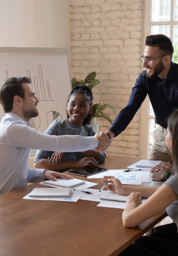 our-values-happy-millennial-multiethnic-male-colleagues-handshake
